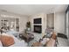 Inviting living room with a fireplace, modern furniture, and open access to the dining area at 3476 Silver Maple Dr, Duluth, GA 30096