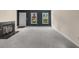 Spacious living room with a fireplace and neutral-toned walls at 3476 Silver Maple Dr, Duluth, GA 30096