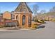Charming Woodhaven subdivision entrance with brick signage and lush greenery along the street at 3476 Silver Maple Dr, Duluth, GA 30096