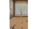 Close-up of a large bathtub in the bathroom with sheer curtains on the window at 522 Plantation Creek Dr, Loganville, GA 30052