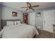 Cozy bedroom featuring a comfortable bed, ceiling fan, and neutral tones at 522 Plantation Creek Dr, Loganville, GA 30052