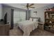 Bedroom with a ceiling fan and a gray color scheme with light accents at 522 Plantation Creek Dr, Loganville, GA 30052