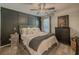 Bedroom with dark trim, ceiling fan, and neutral colored furniture and walls at 522 Plantation Creek Dr, Loganville, GA 30052