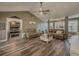 Cozy living room with sofas, a large coffee table, and wood floors, ideal for gatherings and relaxation at 522 Plantation Creek Dr, Loganville, GA 30052