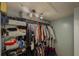 Spacious walk-in closet with shelving for clothing and other storage items at 522 Plantation Creek Dr, Loganville, GA 30052