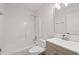 Bathroom with tub-shower combination, toilet, mirror and a vanity with white sink at 1553 Pinebreeze Dr, Marietta, GA 30062