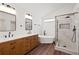 Contemporary bathroom featuring double vanity, soaking tub and glass enclosed shower at 1553 Pinebreeze Dr, Marietta, GA 30062