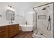 Modern bathroom features a freestanding tub and tiled shower with glass surround at 1553 Pinebreeze Dr, Marietta, GA 30062