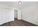 Bedroom featuring wood-look floors, a closet, and light walls at 1553 Pinebreeze Dr, Marietta, GA 30062