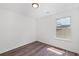 Bedroom with wood-look floors, light walls, and a window at 1553 Pinebreeze Dr, Marietta, GA 30062