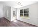 Bright bonus room features hardwood floors, natural light, and a door that leads to the backyard at 1553 Pinebreeze Dr, Marietta, GA 30062