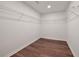 Walk-in closet featuring laminate wood flooring and wire shelving at 1553 Pinebreeze Dr, Marietta, GA 30062