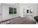 Sunlit dining room featuring large windows, hardwood floors, and a seamless transition to other rooms at 1553 Pinebreeze Dr, Marietta, GA 30062