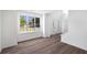 Bright, open-concept dining area with hardwood floors, white walls, and large windows at 1553 Pinebreeze Dr, Marietta, GA 30062