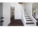Bright foyer with hardwood floors, staircase, white molding, and high ceilings at 1553 Pinebreeze Dr, Marietta, GA 30062