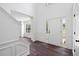 Bright foyer with hardwood floors, staircase, high ceilings, and white trim at 1553 Pinebreeze Dr, Marietta, GA 30062