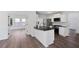 Open kitchen layout showcasing granite countertops, stainless steel appliances, and breakfast bar at 1553 Pinebreeze Dr, Marietta, GA 30062