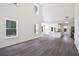 Open-concept living area with tall ceilings, large windows, and hardwood floors throughout at 1553 Pinebreeze Dr, Marietta, GA 30062
