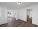 Bright and open living area with hardwood floors and access to the kitchen at 1553 Pinebreeze Dr, Marietta, GA 30062
