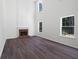 Bright living room with a tall ceiling, a fireplace, and three large windows for natural light at 1553 Pinebreeze Dr, Marietta, GA 30062