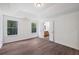 Main bedroom featuring wood-look floors, light walls and an ensuite bathroom at 1553 Pinebreeze Dr, Marietta, GA 30062