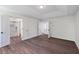 Main bedroom featuring wood-look floors, light walls and an ensuite bathroom and shower at 1553 Pinebreeze Dr, Marietta, GA 30062