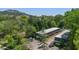 Aerial view of townhouses complex surrounded by lush greenery and conveniently located near parking and streets at 305 Stonecliff Ct, Stone Mountain, GA 30083