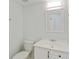Clean bathroom features a white vanity with chrome fixtures, ample lighting, and tile floors at 305 Stonecliff Ct, Stone Mountain, GA 30083