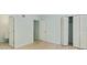 Spacious bedroom with closet space and access to a bathroom and additional rooms at 305 Stonecliff Ct, Stone Mountain, GA 30083
