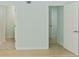 Bright hallway leading to bathroom and bedroom with modern flooring at 305 Stonecliff Ct, Stone Mountain, GA 30083