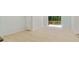 Bright living room featuring hardwood floors and a sliding door to a private outdoor balcony at 305 Stonecliff Ct, Stone Mountain, GA 30083