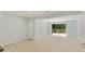 Bright living area with hardwood floors, neutral paint, and access to a private outdoor deck with natural views at 305 Stonecliff Ct, Stone Mountain, GA 30083