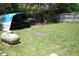 Backyard featuring a shed and propane tank, enhanced by sunlight at 31 Dogwood Nw Ln, Cartersville, GA 30121