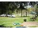 Spacious backyard featuring mature trees, swing set and a grassy lawn at 31 Dogwood Nw Ln, Cartersville, GA 30121