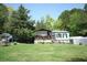 Cozy single-story home featuring light blue siding and a covered front porch in a lush, green setting at 31 Dogwood Nw Ln, Cartersville, GA 30121