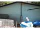 Home exterior featuring light blue siding, fenced yard and metal storage units at 31 Dogwood Nw Ln, Cartersville, GA 30121