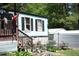 Charming single-story home featuring light blue siding and a covered porch, complemented by an inviting outdoor landscape at 31 Dogwood Nw Ln, Cartersville, GA 30121