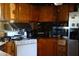 Kitchen featuring wood cabinets, a range, and stainless steel appliances at 31 Dogwood Nw Ln, Cartersville, GA 30121