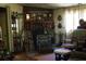 Cozy living space featuring a unique fireplace, display cabinet, and comfortable seating at 31 Dogwood Nw Ln, Cartersville, GA 30121