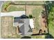 Aerial perspective of the house with the backyard featuring a patio and landscaped yard, providing privacy with its fenced perimeter at 1337 Highfield Dr, Lawrenceville, GA 30043