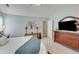 Well-lit bedroom featuring neutral walls, carpet floors, a ceiling fan, and a window for natural light at 1337 Highfield Dr, Lawrenceville, GA 30043