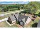 Aerial view of a single-story home featuring a well-manicured front yard with lush landscaping and a long driveway at 1337 Highfield Dr, Lawrenceville, GA 30043