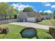 Charming home with a front lawn, a paved driveway, a 2-car garage, and a community entrance sign at 1337 Highfield Dr, Lawrenceville, GA 30043