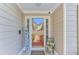 Charming front entrance with a decorative welcome sign, a glass door, and a cozy seating arrangement adding curb appeal at 1337 Highfield Dr, Lawrenceville, GA 30043