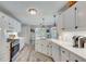 Well-lit kitchen with white cabinetry, quartz countertops, and modern appliances at 1337 Highfield Dr, Lawrenceville, GA 30043