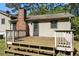 Home's wooden deck features a simple design, steps, and outdoor access at 2062 Skyhawk Ln, Acworth, GA 30102