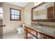 Bathroom featuring a granite countertop vanity, and natural light from window at 2062 Skyhawk Ln, Acworth, GA 30102
