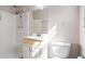 Sunlit bathroom featuring a shower, toilet, and modern vanity at 2062 Skyhawk Ln, Acworth, GA 30102