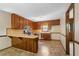 Classic kitchen with wooden cabinetry, neutral countertops, and modern stainless steel appliances at 2062 Skyhawk Ln, Acworth, GA 30102
