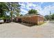 Rear exterior view of the brick house with a parking area at 2844 Whispering Hills Dr, Chamblee, GA 30341